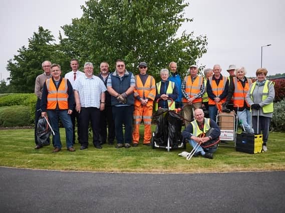 Pictured are members of the Anston and Dinnington group, who picked their 2,000th bag of litter, with local ward councillors Clive Jepson (far left), Jonathan Ireland (second left), and John Vjestica (6th left), Neighbourhood Development Officer Steve Lavin (4th left), Love Where You Live co-ordinator Wayne Munro-Smith (5th from left) and Streetpride operative Richard O'Donoughue (centre).