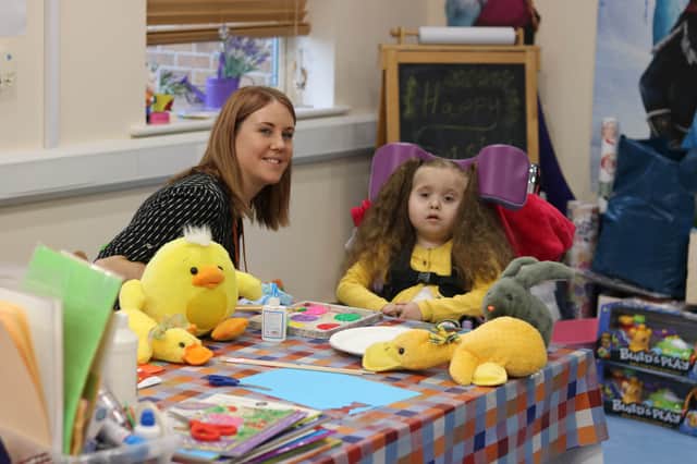 Evie-Mae enjoys some Easter crafts with Bluebell Wood sibling support worker Amy Panton