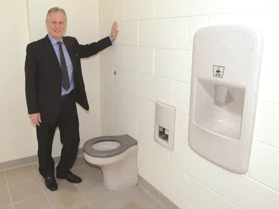 Cllr Thirlwall, project manager, is pictured in the new toilets. 170357-4.