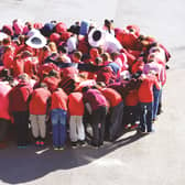 Pupils at Swallownest Primary School created a giant red nose in the playground.