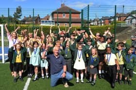 Marathon man Ray Matthews was at St Bede's Catholic Primary School recently to hand out medals to pupils who were the winning team in the Rotherham Fun Run held at Clifton Park in May.