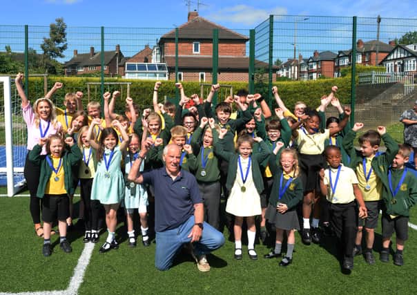Marathon man Ray Matthews was at St Bede's Catholic Primary School recently to hand out medals to pupils who were the winning team in the Rotherham Fun Run held at Clifton Park in May.