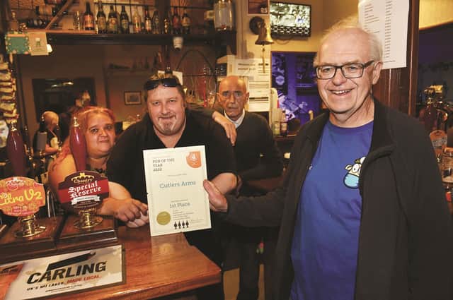 Winners of the Rotherham CAMRA Pub of the Year title for 2022, The Cutlers Arms on Westgate. Presenting the award is CAMRA vice chairman, Paul Redfern to staff (from left to right), Kerry Garner, manager, Mick Hill, promoter and Grham Woodhouse, manager. 220858