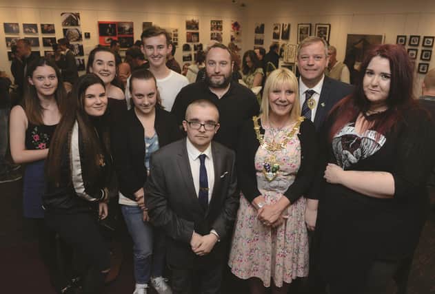 Level two and level three diploma in photography students have their work on display in the Phosphene 17 exhibition at Riverside House. The Mayor of Rotherham Cllr Eve Rose Keenan and her Consort Pat Keenan joined programme leader Lance Burkitt (back centre) and some of the students on the opening night. The exhibition runs until the 23rd June. 170981-1