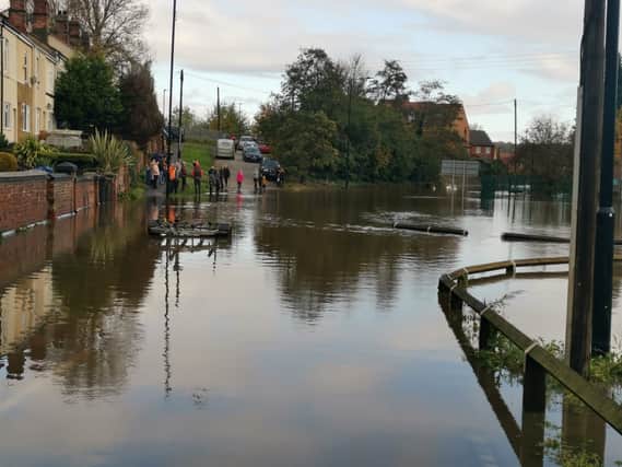 People were spotted gathering near floodwater on Doncaster Road in Mexborough today.