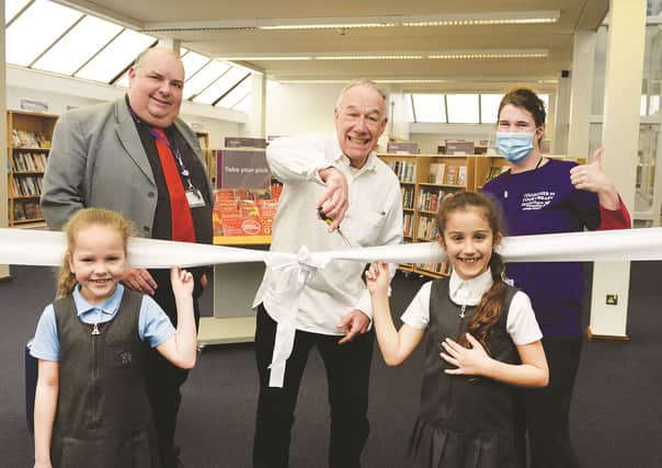 Poet and songwriter Ray Hearne cut the ribbon watched by local councillor Alan Atkin, library and neighbourhood hubs officer Danuta Watkinson, and libary visitors Lydia Jarvis (front left) and Isabella Brenes-Obregon.