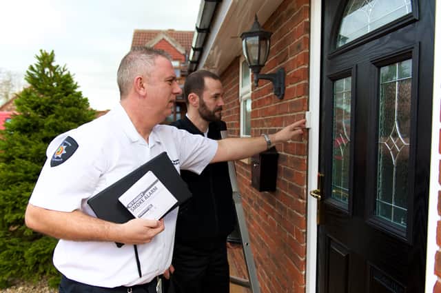Fire community support officers Andy Hall (left) and John Tinsley (right) carry out home safety checks.