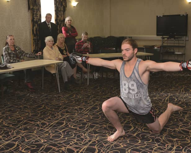 Josh Foers performing his dance in front of tattooist Westley Smith, family members, the Mayor of Rotherham Cllr Eve Rose Keenan and her Consort Pat Keenan at the Town Hall