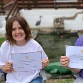 Rebecca (left) and Dean Sills with their Flight Desk Festival certificates.