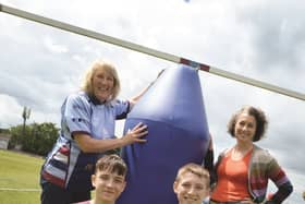 Titans Community Foundation trustee Lindsay Jones (back left), Sarah Champion MP and young rugby players Oliver Uff (front left) and Cory Ghent-Clark with an inflatable tackle dummy.