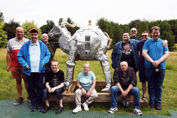 Members of the Wath Community Connect Group teamed up with local artist, Jason Thomson (3rd left), to produce a sculpture for the 'Forest of Bewilderment' area at Wentworth Woodhouse. The sculpture took four months to produce and will be named 'The Creature of Curiosity'. 230497-1