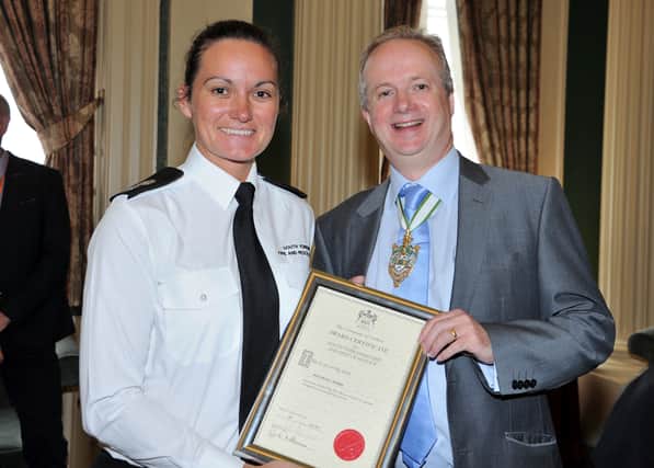 Watch Manager Nicola Hobbs is presented with her prize by Master Cutler, Richard Edwards.