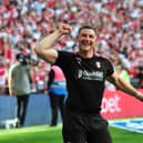All smiles...Richie Barker laps up Sunday's League One play-off final win over Shrewsbury at Wembley.