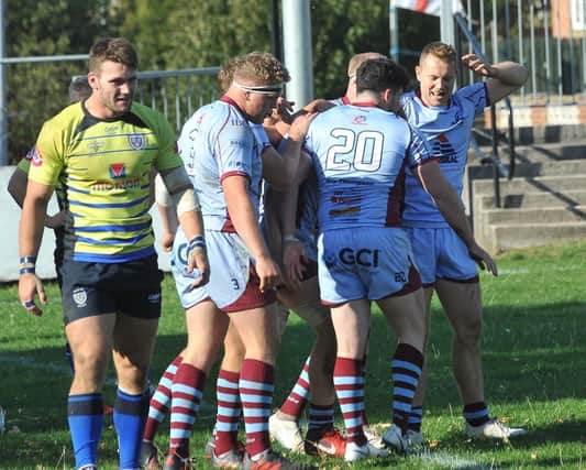 Titans celebrate one of their four tries against Sale FC at Clifton Lane on Saturday. Pictures: KERRIE BEDDOWS
