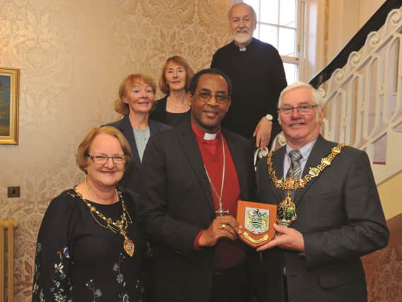he Mayor and Mayoress of Rotherham, Cllr Alan and Mrs Sandra Buckley, are seen presenting a Rotherham crest shield to Bishop Eraste Bigirimana, from the Bujumbura Diocese of Burundi, during a recent visit. Seen also at the visit are (left to right) Carol Bracken, Linda Barnes and Canon Donald Werner. A school and University in Burundi have ties to Aston Academy, where the Bishop also visited. 184337