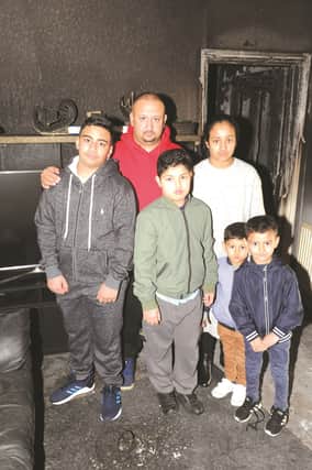 Saved by the bell, Zaheer Ahmed, who along with family members, (from left to right), Awais, Raheem, Malaika, Izaan and Ilyas managed to escape from their burning hosuse after the smoke alarm gave them a vital early warning