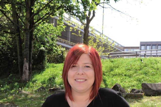 Sara outside the town centre car park