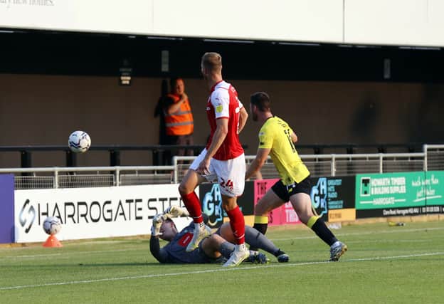 Michael Smith scores his second goal at Harrogate. Picture by Jim Brailsford