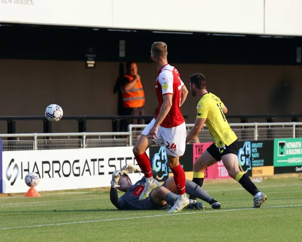 Michael Smith scores his second goal at Harrogate. Picture by Jim Brailsford