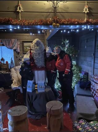 Courtney (left), Caprianha (second right) and mum Michelle Walker meeting Santa