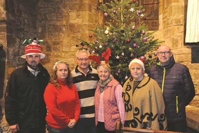 Seen at St Peter's Church, Conisbrough, are members of the Henderson family, who are hosting a Christmas Lunch on Christmas Day for any lonely people in the area, at the church hall. Family members (left to right) are: Wayne and Sarah Hackett, Peter and Margaret Henderson, Jacquie Lewis and Jason Morris. The family would like to thank users of Current Affairs Facebook page, and Vivo Restaurant, Bennett Thorpe and everyone else for their kind donations. 172104
