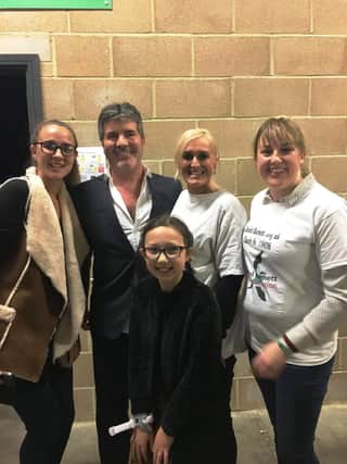 From left: Katie Walker, Simon Cowell, Jennii Suphanit, Diane Barnett and Angela Suphanit.