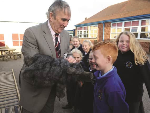 After a few years of fundraising by Friends Association of Bramley Sunnysides Schools (FABSS), a new outdoor classroom is seen being opened by Rotherham born author, Gervase Phinn. Mr Phinn is seen showing a pupil on of his hand puppets. 190020-2