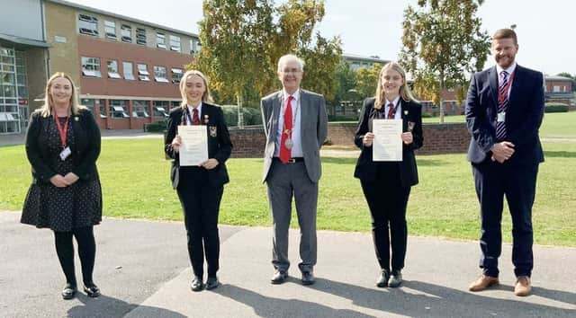 Katie Booth (centre left) and Elli-Jane Little (centre right) receive their scholarship funds from Feoffees Greave, Tony Grice. Also pictured are Wath sixth form head …Slasor and principal Liam Ransome.