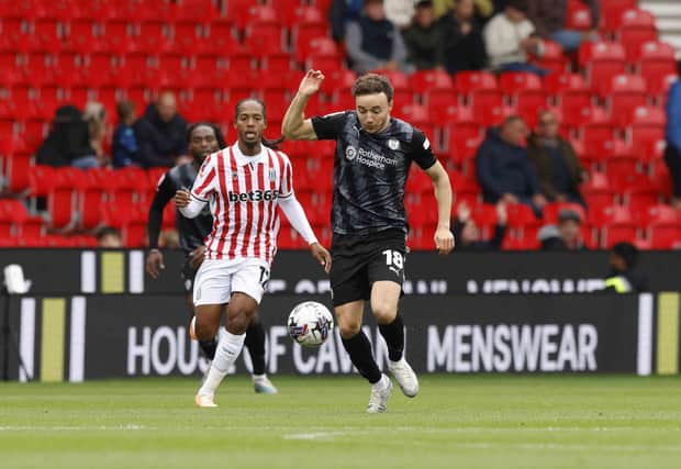 Ollie Rathbone in first-half action for Rotherham United in the Championship at Stoke City: Picture: Jim Brailsford