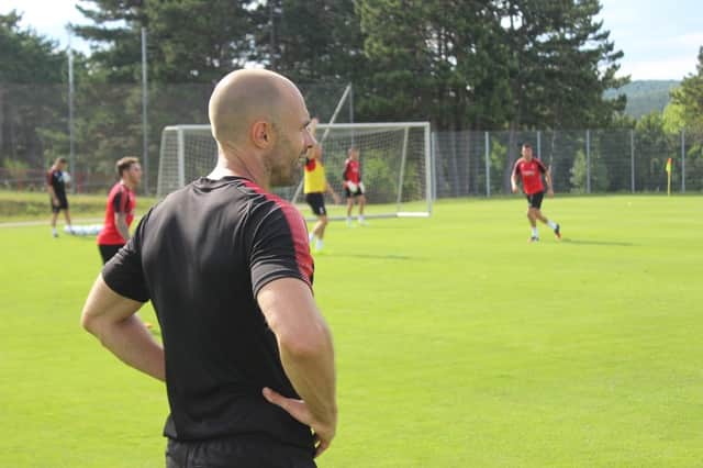 Paul Warne watches over training in Austria. Image: RUFC