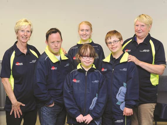 Members of the Dearne Valley Special Olympics Group are seen with their new kit ahead of representing Yorkshire and Humberside in the upcoming Special Olympics Summer Games. Equestrian team members taking part (left to right) are: Josie Southwell, group secretary; Matthew Gregory, Alyssia Marsh, groom; Charlotte Feron (8), Jonathan Dexter (11) and Marjorie Sheppard, coach. 171334-3