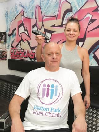 Seen at Twisted Scissors hair salon is David Widdowson, who has had his head shaved to raise money for Weston Park Cancer Charity, by Lyndsey Woodcock, hair stylist. David is raising money for the charity as his son, Tim Widdowson (35), is undergoing treatment for a brain tumour. 171252-3