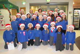 The youngsters from St Mary’s Catholic Primary School Choir are pictured with teachers and RDaSH staff.