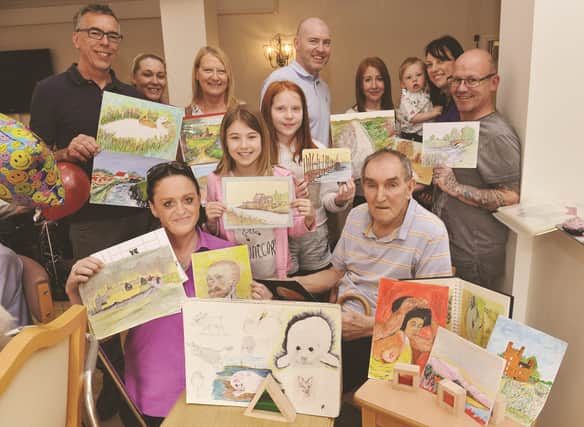 Clifton Meadows resident and artist George Roberts (front right) had his artwork on display during an event to mark the National Care Home Open Day. He is pictured with his family members, care home manager Kerry Lawton (back row, second left) and deputy manager Louise Cook (front left). 180596-1