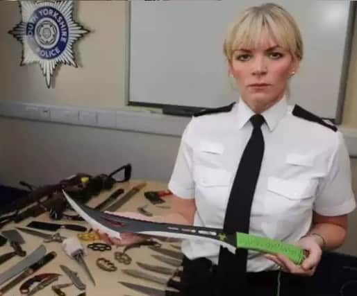Det Supt Una Jennings with some of the weapons handed in during previous weapons surrenders