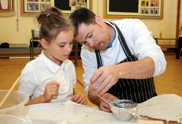 Year 6 pupil Megan Hallam with Carlton Park Hotel head chef, Paul Spruce.