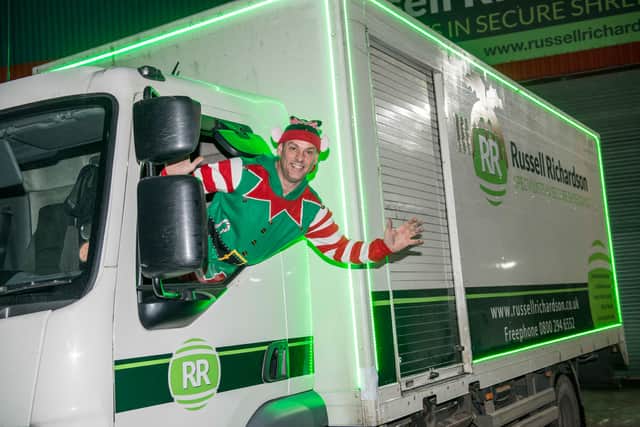 Sheffield secure shredding business Russell Richardson turn their mobile shredder green with neon lights for the festive season