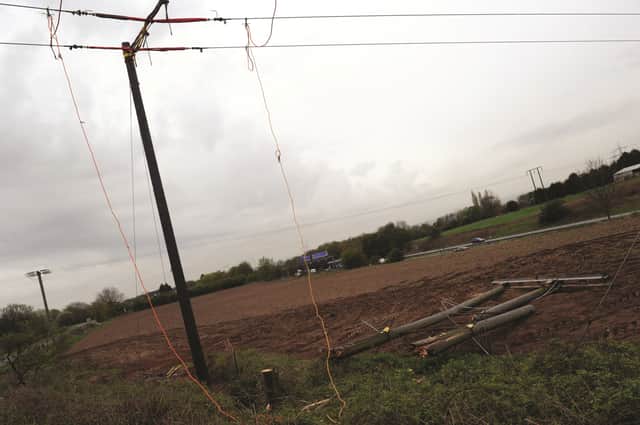 The damaged telephone pole after the crash