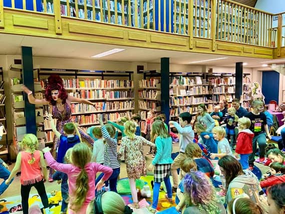 Aida H Dee in action during Drag Queen Story Hour