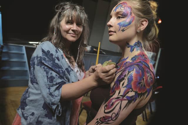 Julia-Marie Harris of Julia Arts demonstrates her body art painting with the help of model Jade Morris. 171492-5