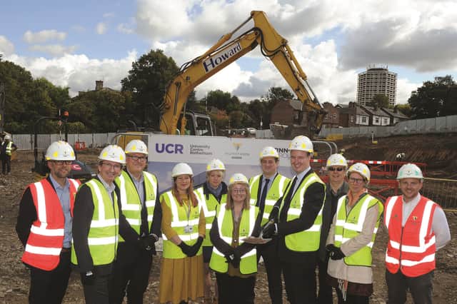 Rotherham Borough Council leader Cllr Chris Read (fourth right), is seen with representatives of RNN Group and Willmott Dixon, at the event. 171572-1