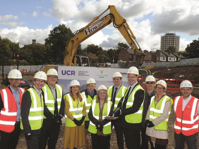 Rotherham Borough Council leader Cllr Chris Read (fourth right), is seen with representatives of RNN Group and Willmott Dixon, at the event. 171572-1