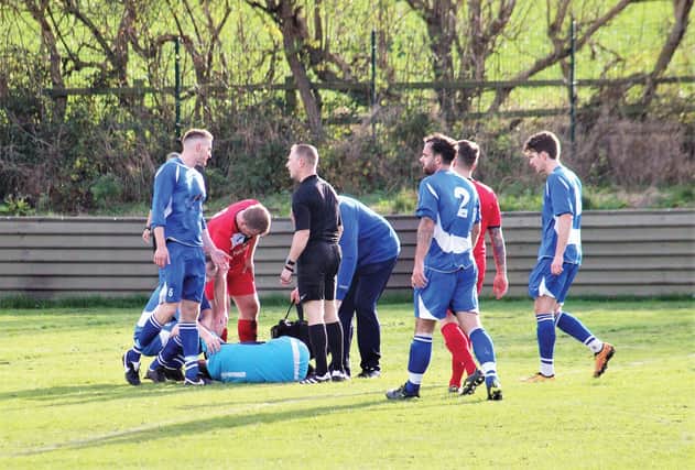 CAREER-ender, Swallownest keeper Jamie King suffers a broken leg at Armthorpe. Picture courtesy Armthorpe Welfare.
