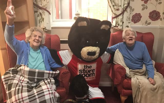 Louis Page and Jean Greaves enjoy meeting Rotherham United FC mascot Miller Bear at Broadacres Care Home.