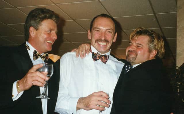 Tony Robinson, centre, with friends