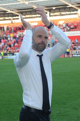 Thanks...Paul Warne acknowledges the fans during the lap of honour after the final whistle. Pics: Steve Mettam