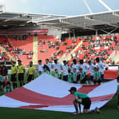 The teams line up before last week's Group clash between England and Switzerland.