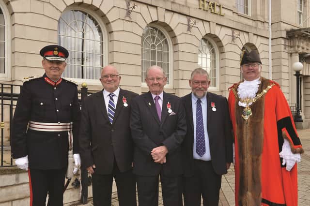 Her Majesty's Lord-Lieutenant of South Yorkshire Andrew Coombe recently presented the British Empire Medal to three Rotherham recipients. David Woodward (second left), Brian Yeoman (centre) and Michael Speight were awarded the medal at a ceremony at the Town Hall attended by the Mayor of Rotherham Cllr Alan Buckley. 1842808-3