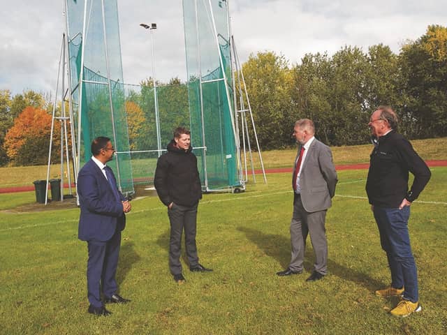 Herringthorpe Stadium Refurb-Head of Sports and Leisure and Strategic Partnership, Chris Siddall (2nd left) shows Cllrs Sagir Alam and David Sheppard along with Rotherham Harriers secretary, Steve Gaines around the new improvements to the stadium. 220896-2