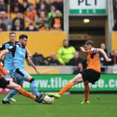 Anthony Forde tussles with Wolves' George Saville and Dave Edwards. Picture: Trevor Price